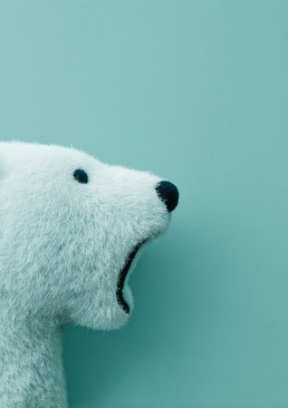 This image features a cute plush polar bear toy against a soft blue background. The toy's expressive face adds a playful touch, making it perfect for children's decor or gift ideas. ai generated.の素材
