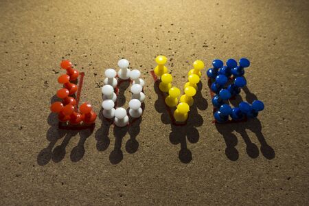 Colorful Love text written with thumbtacks on cork under spotlight. Usable for valentine's day.の写真素材