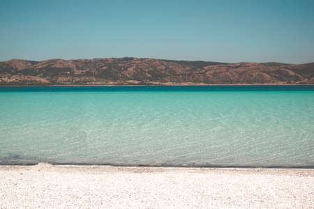 Shot of a risale-i nur and a coffee on a table at a house by the sea with beautiful sea on the...