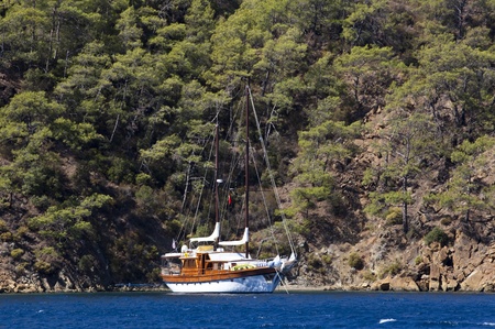 old style wooden sailing boat on a voyage over mediterranean sea のeditorial素材