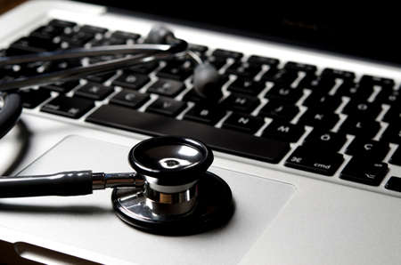 Close up of stethoscope on keyboardの写真素材