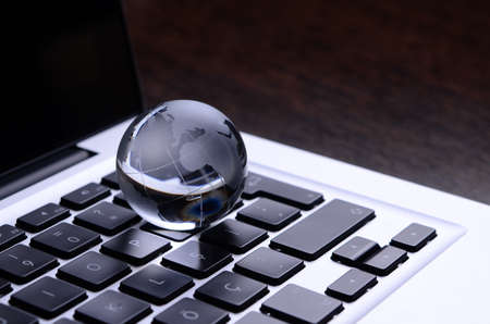 Terrestrial globe and note PCの写真素材