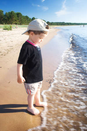 Boy on the summer beachの写真素材