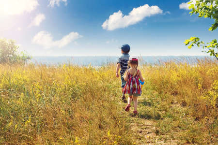 Boy and girl are going to the sea