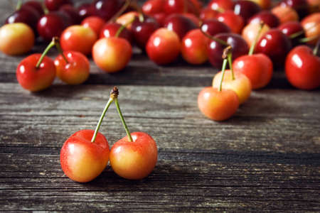 Cherry on old wooden boardの写真素材