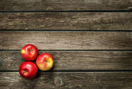 Apples on wooden backgroundの写真素材
