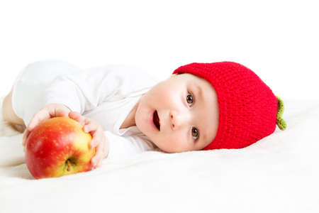7 month old baby in apple hatの写真素材