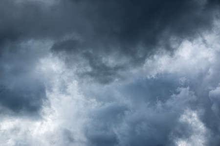 Dramatic clouds on the blue sky on sunny dayの写真素材