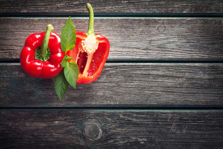 Fresh sweet red pepper on old wooden backgroundの写真素材