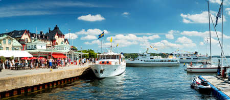 VAXHOLM, SWEDEN - JUNE 25, 2016: Cruise boats at little cosy island Vaxholm near Stockholmのeditorial素材