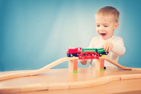 Portrait of a two years old child sitting at the table