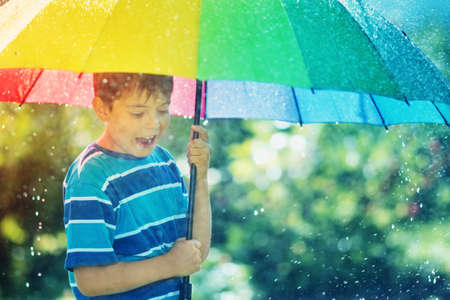 Child walking on rainy weatherの写真素材