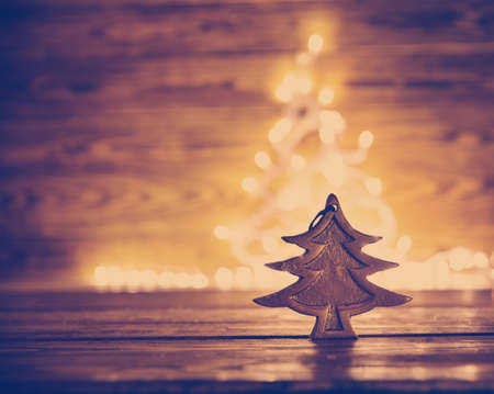 Fir tree toy on wooden backgroundの写真素材