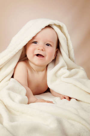 Cute baby in a towelの写真素材