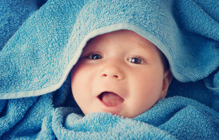 Cute baby in a towelの写真素材