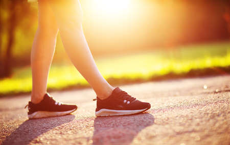 Young woman running in the parkの写真素材