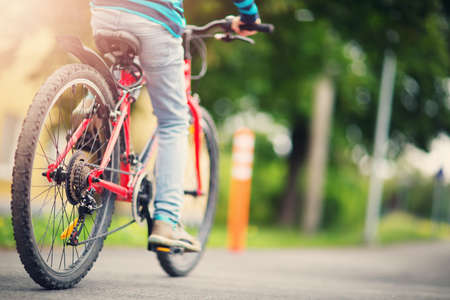 child on a bicycle on pedestrian wayの写真素材