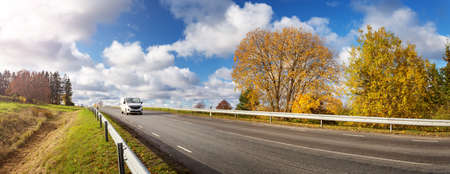 Road at falls on sunny day. Highway in autumnの写真素材