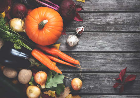Mixed vegetables on old weathered wooden backgroundの写真素材
