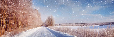 winter road, covered with snow on sunny dayの写真素材