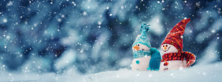 little snowmans on soft snow on blue backgroundの写真素材