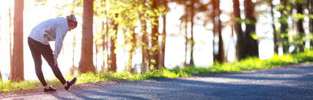 Young woman running in the parkの写真素材