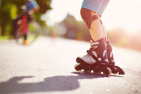 child on roller Skates in the eveningの写真素材