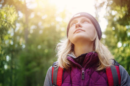 Young woman hiking and going camping in natureの写真素材