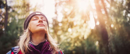 Young woman hiking and going camping in natureの写真素材
