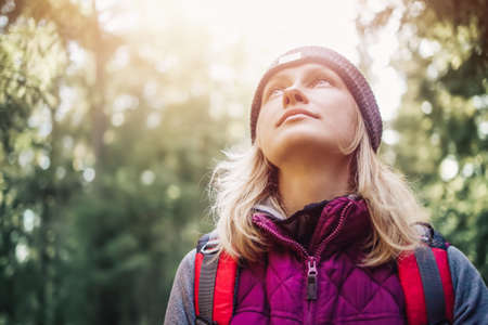 Young woman hiking and going camping in natureの写真素材