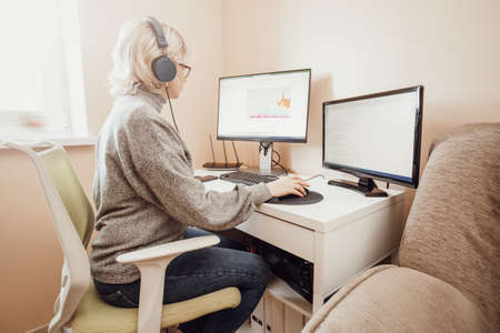 woman working at home with little child.