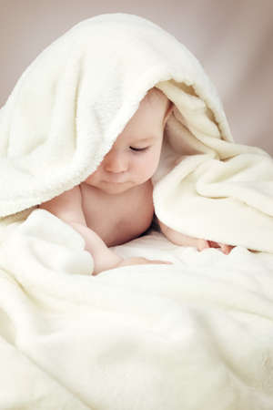Cute baby in a towelの写真素材