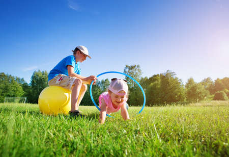 Children are playing on the sport fieldの写真素材