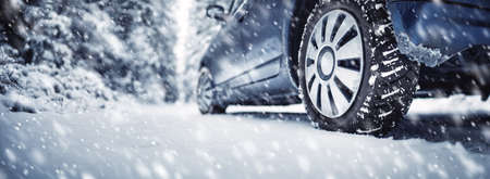 The car stopped on the roadside in a winter blizzard.の写真素材