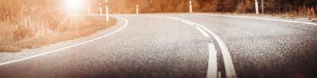 Asphalt road panorama in countryside on sunset in summer.の写真素材