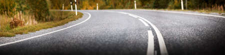 Asphalt road panorama in countryside on sunny summer day.の写真素材