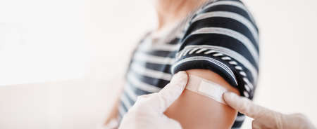 Woman and a doctor in the hospital after vaccination against Covid 19.の写真素材