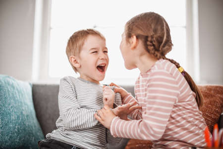 Two little kids having fight at home.の写真素材