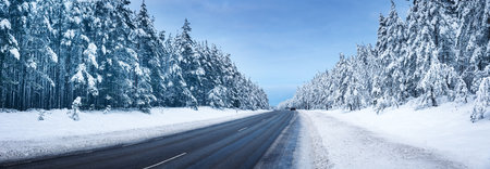 Panoramic view of the beautiful country road in winterの写真素材