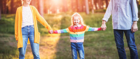 Happy family in the summer in natural parkの写真素材
