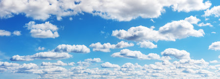 Blue sky with soft white clouds in sunny dayの写真素材