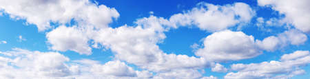 Blue sky with soft white clouds in sunny dayの写真素材