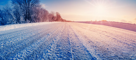 Closeup view of the snowy dirty road in natural parkの写真素材