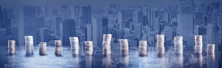 Towers of the coins on the abstract background.の写真素材