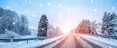Beautiful winter road in natural sunny park.