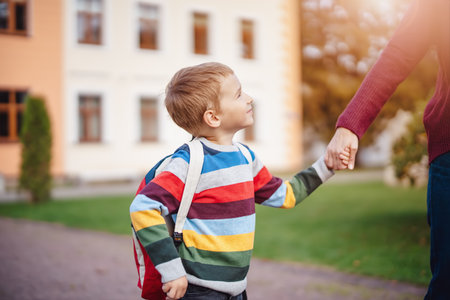 Mother takes her child to educational institution.