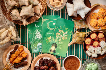 Money packet, Hari Raya food, Ketupat or Malay rice dumpling, satay, cookies and dates.