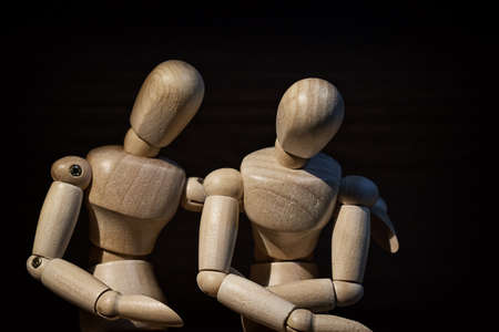 Wooden mannequin, Concern and worry of friend. Mental health, PTSD and suicide prevention. Post-traumatic stress disorder.の写真素材