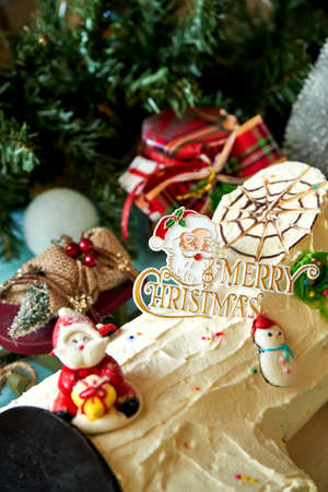 Close up Christmas cake decorated with tree and Santa clause during Christmas celebration.の写真素材