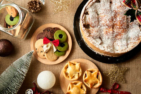 Christmas cake and cookies on rustic backgroundの写真素材